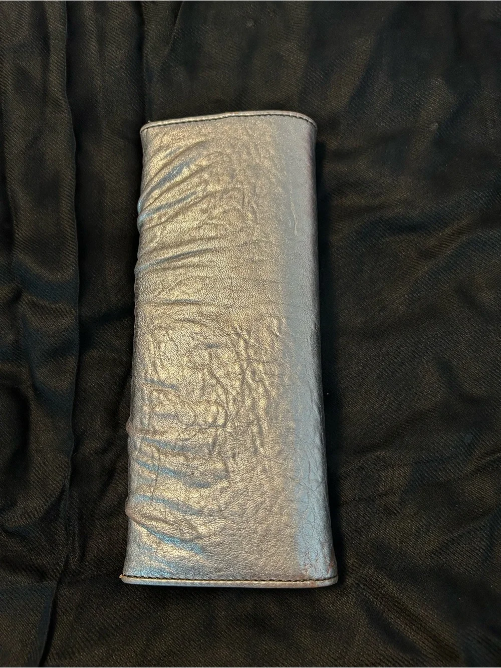 Juicy Couture Silver Leather Woman’s Clutch/Wallet with silver chain trim.